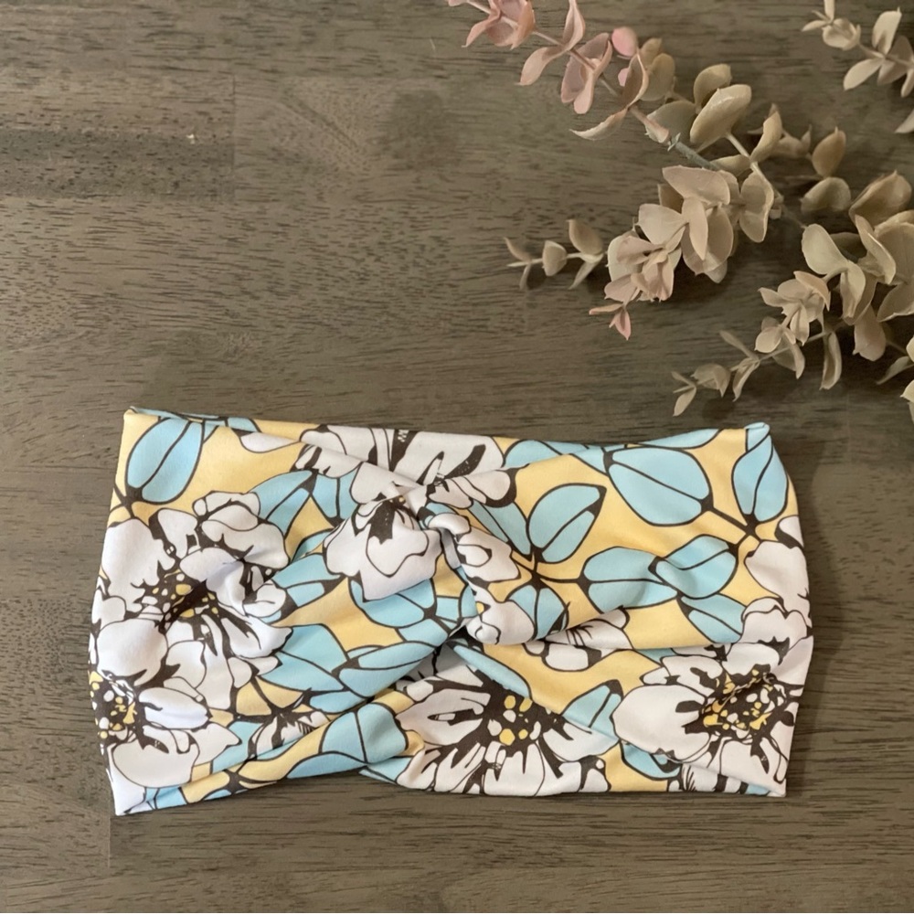 White flower on yellow twist headband